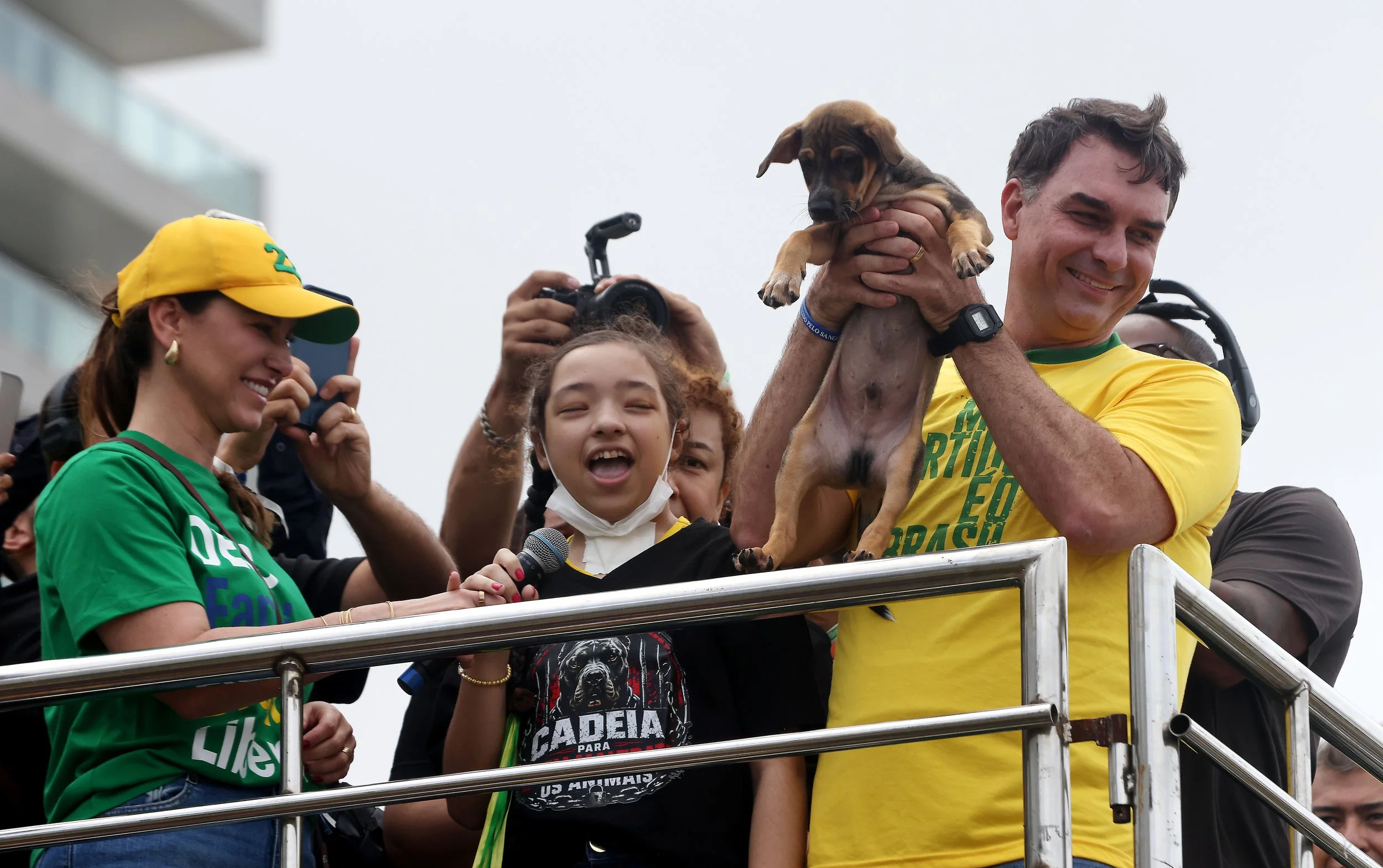 Brazilian Senator and presidential candidate FLAVIO BOLSONARO receives a caramelo-colored puppy as a gift from a supporter during a campaign rally on Copacabana Beach in Rio de Janeiro, Brazil. 