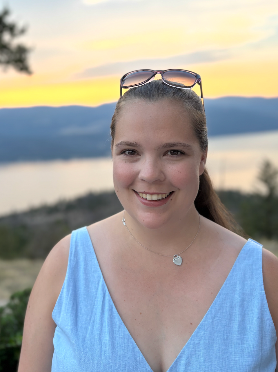 Headshot of Sophie Moors with a sunset in the background