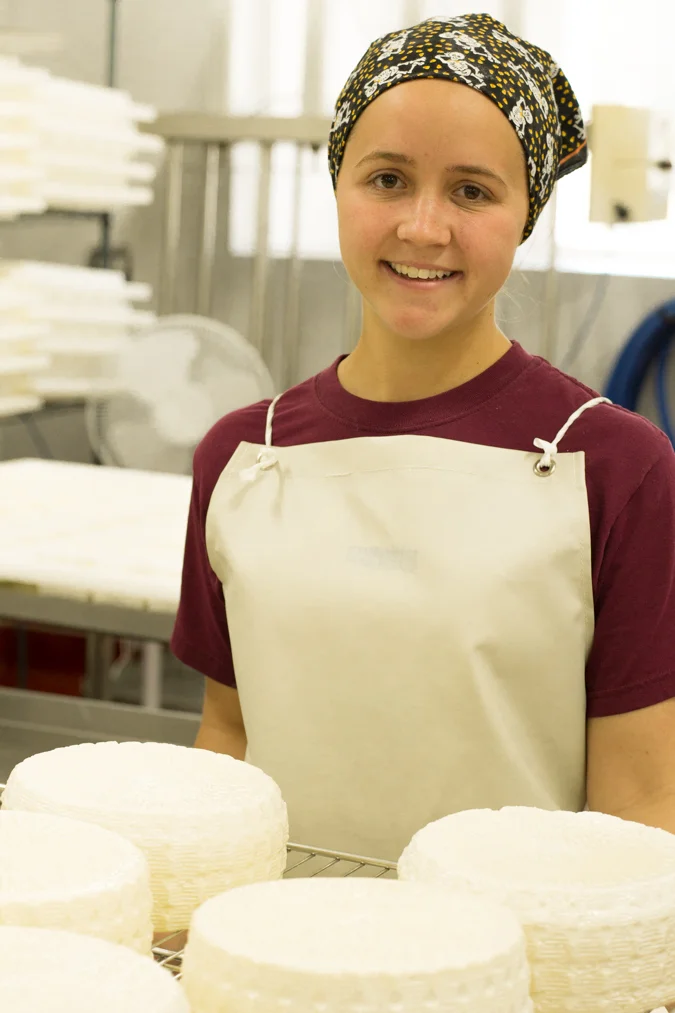 Ashley of Farmstead Creamery with newborn cheese