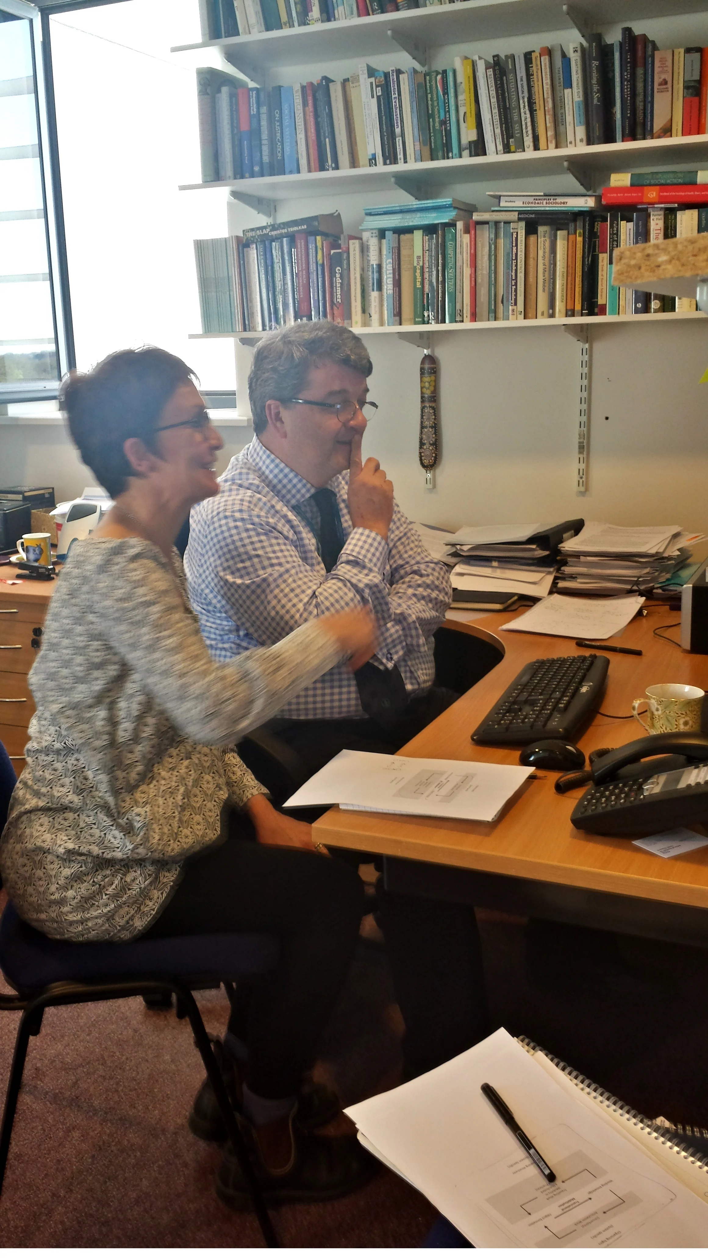 A shot of Professors Allen & May developing the theory