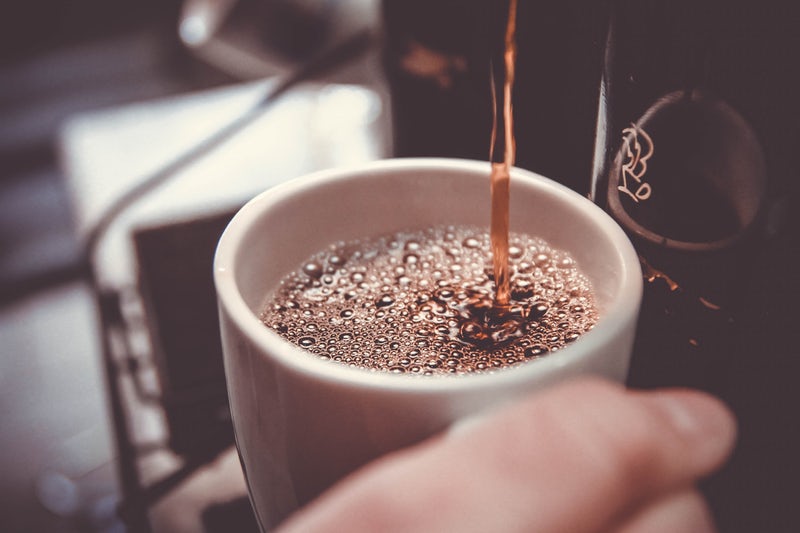 coffee being poured in cup - unsplash.jpg