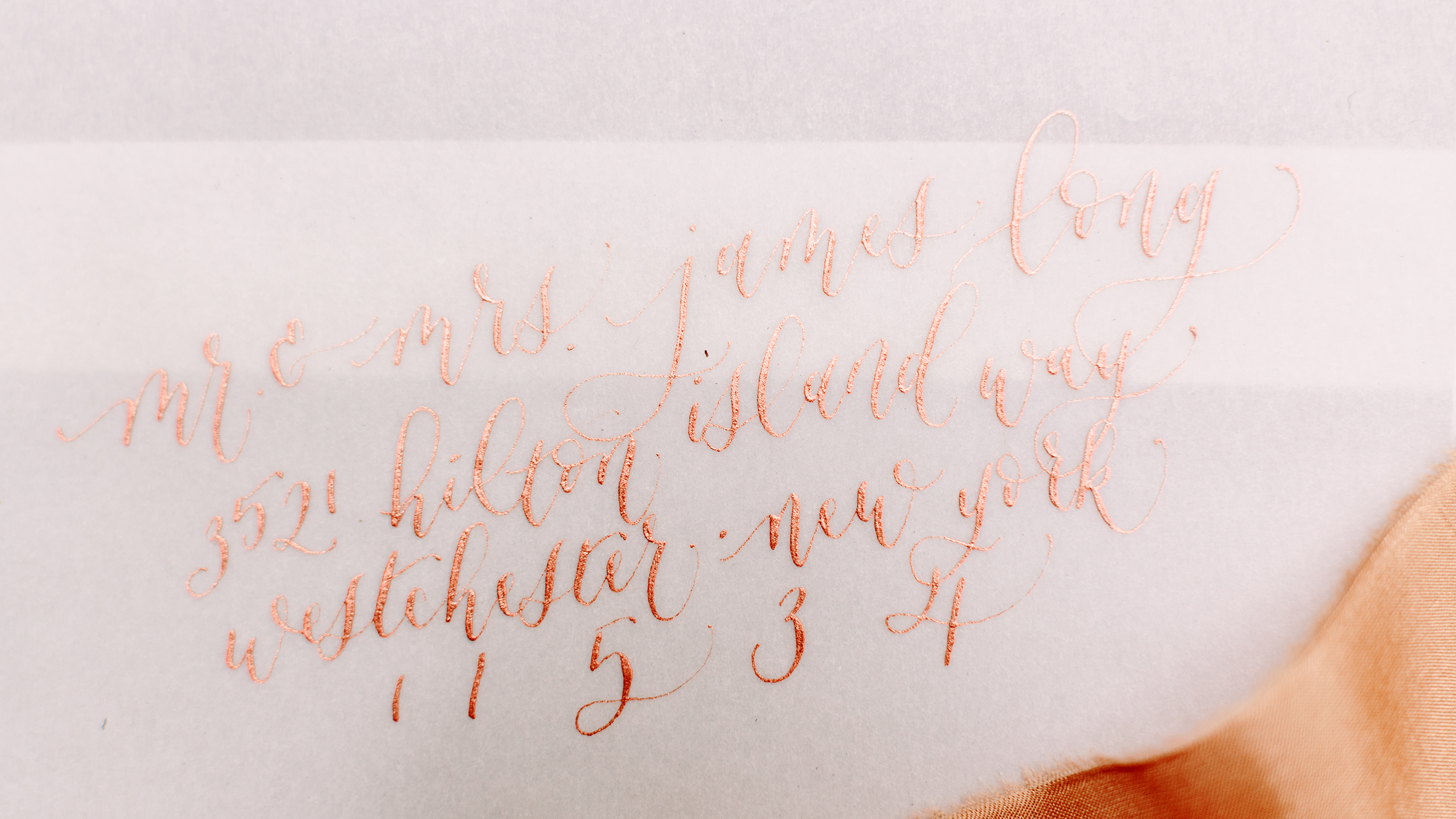 rose-gold-copper-ink-vellum-calligraphy-envelopes-los-angeles.png