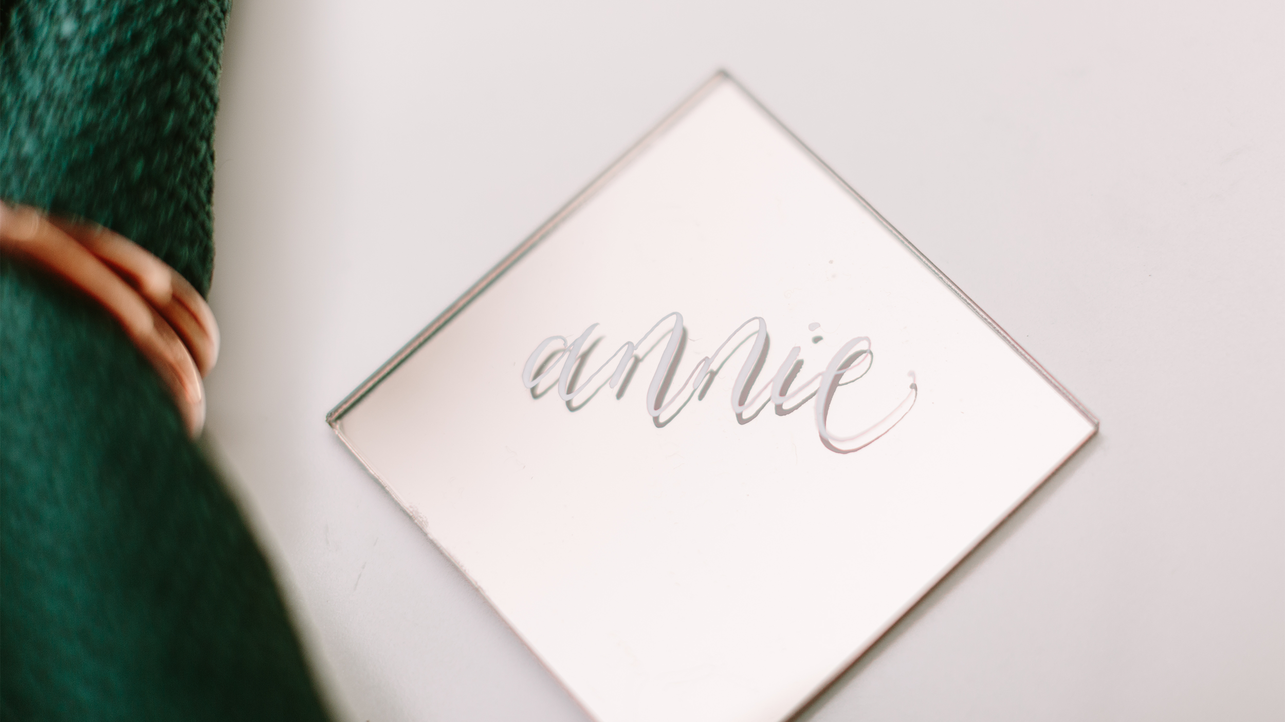 gold mirrored acrylic place card calligraphy