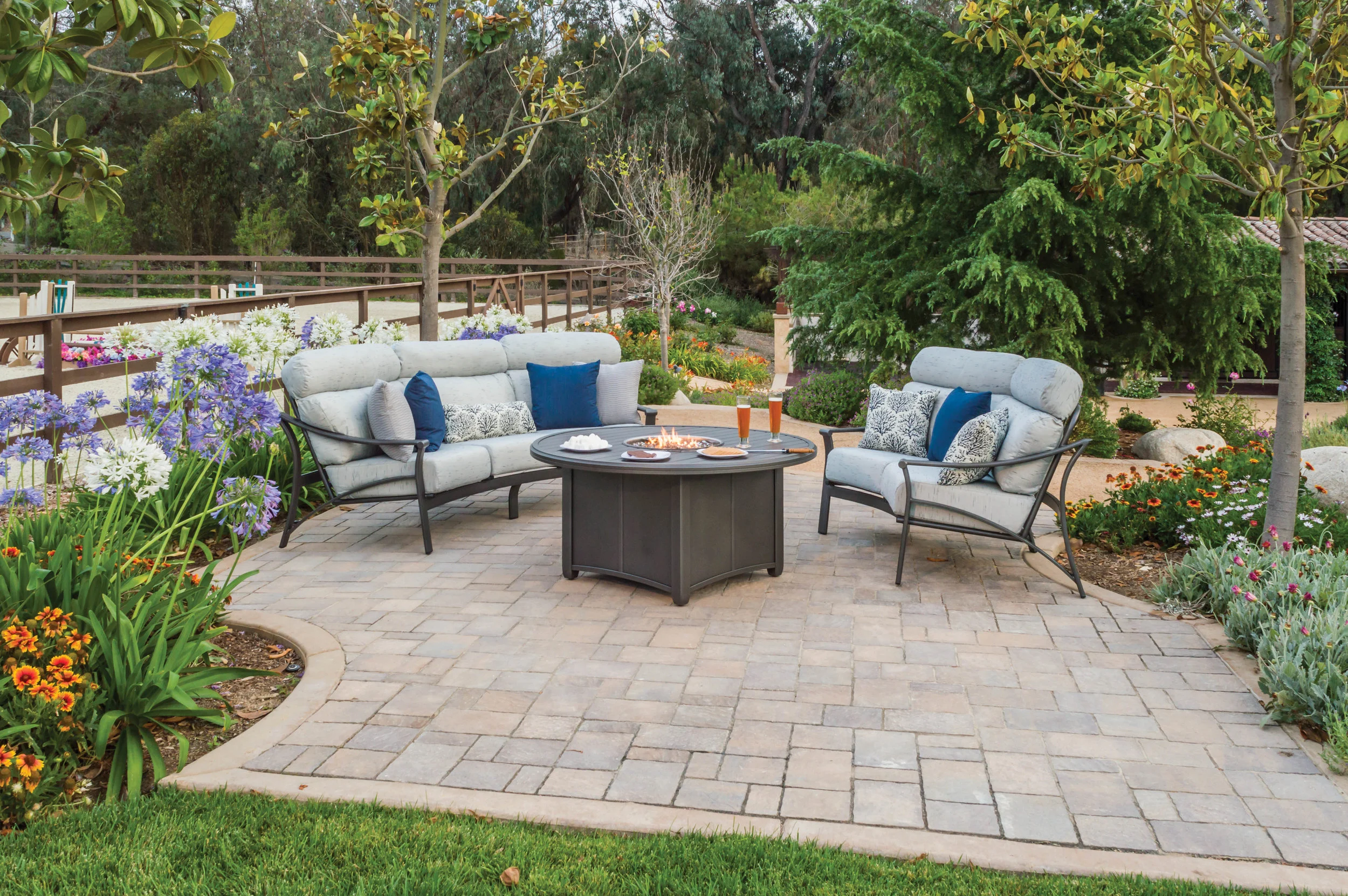 Corsica cushion sofa and loveseat with powder coated aluminum frame and propane cast aluminum firepit. The ultimate in outdoor casual enteraining and dining.
