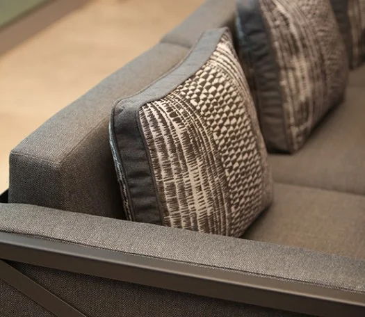 Left facing Creighton sectional chair with accent pillow.