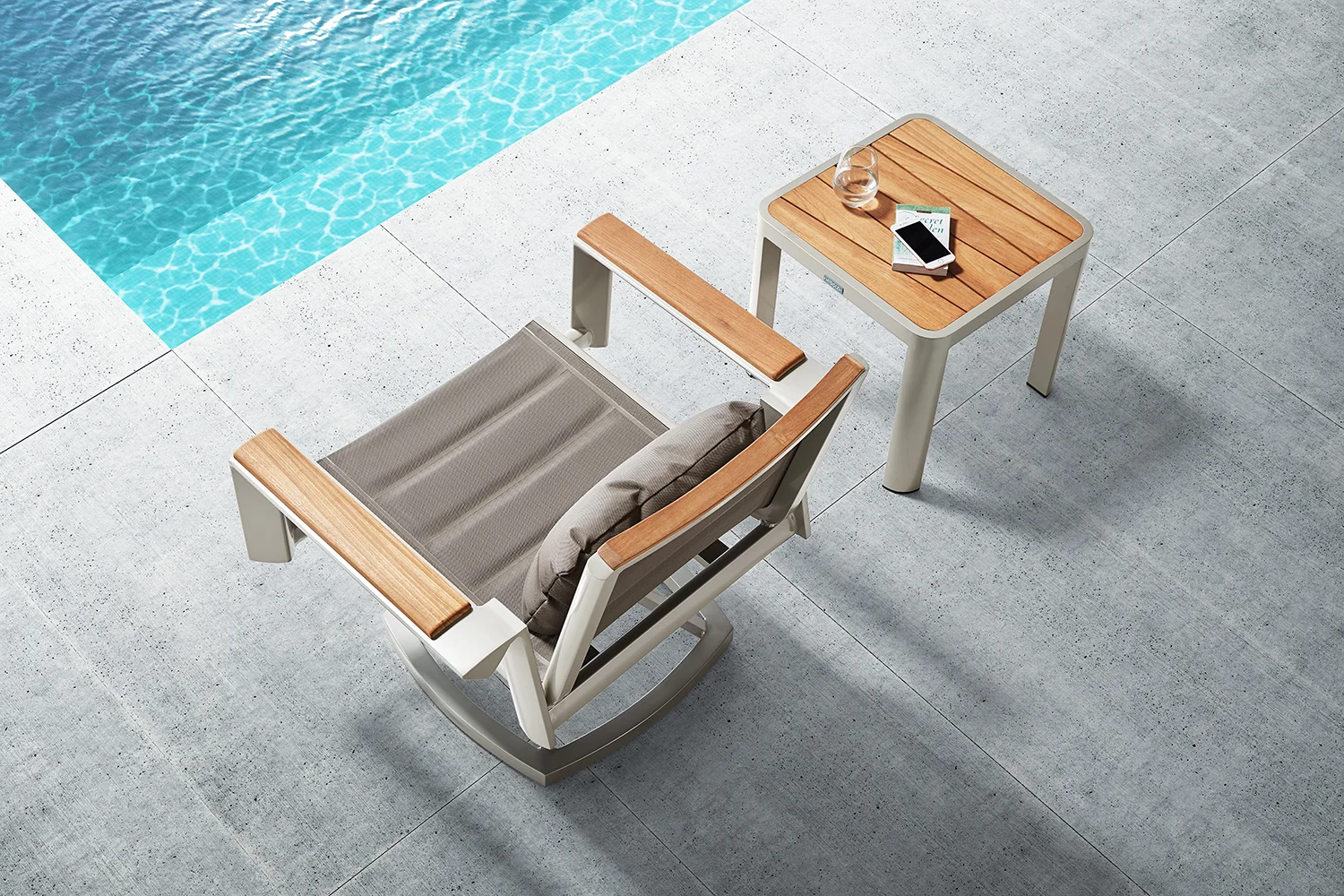 Geneva contemporary swivel rocker lounge chair and teak top side table are perfect for any small area. Padded fabric provides comfort yet is quick drying.