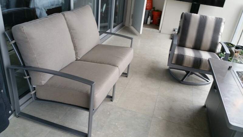 Pacifica Loveseat and Swivel Club Chair on a Balcony 