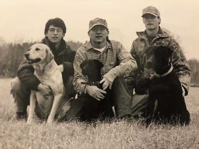 Chip and Ole Miss classmates with their beloved dogs