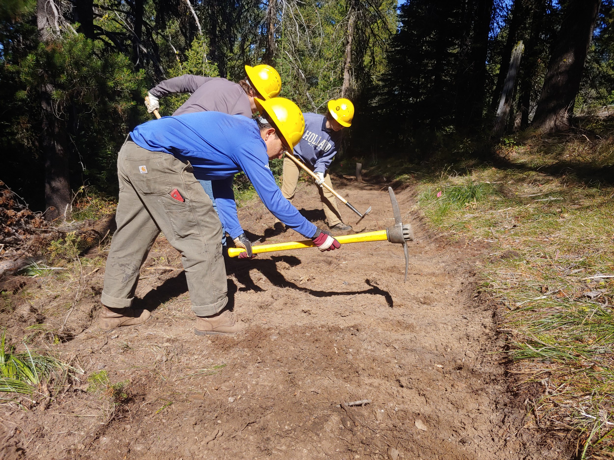 Student Conservation Association members work on the new reroute