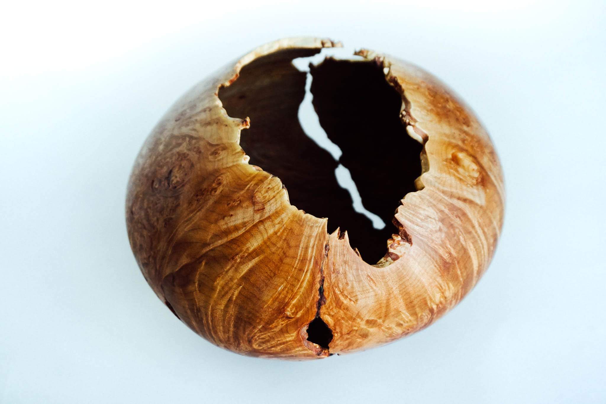This was a very challenging piece to hollow. It is held together by only a few inches of wood toward the bottom. I was both excited and surprised with it’s successful completion.