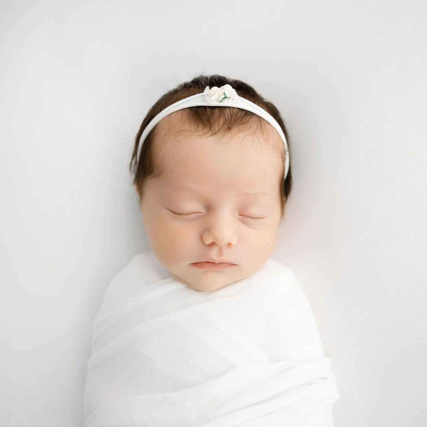 What do you need to bring to your studio newborn session? Just the baby, a diaper bag, and milk/bottles/supplies to nurse. That's it.  I have all the swaddles and bows for your session. In addition, I have a client closet for moms that you are more t