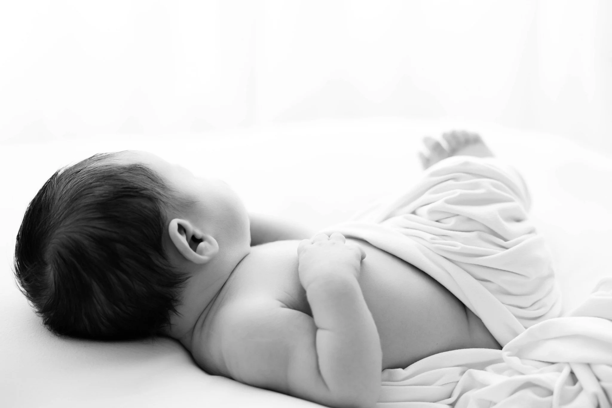 I keep newborn sessions simple and natural, focusing on comfortable positions your baby settles into easily. Posed newborn photography is an art&mdash;and while it&rsquo;s not my jam, there are some incredibly talented photographers in the Triangle w