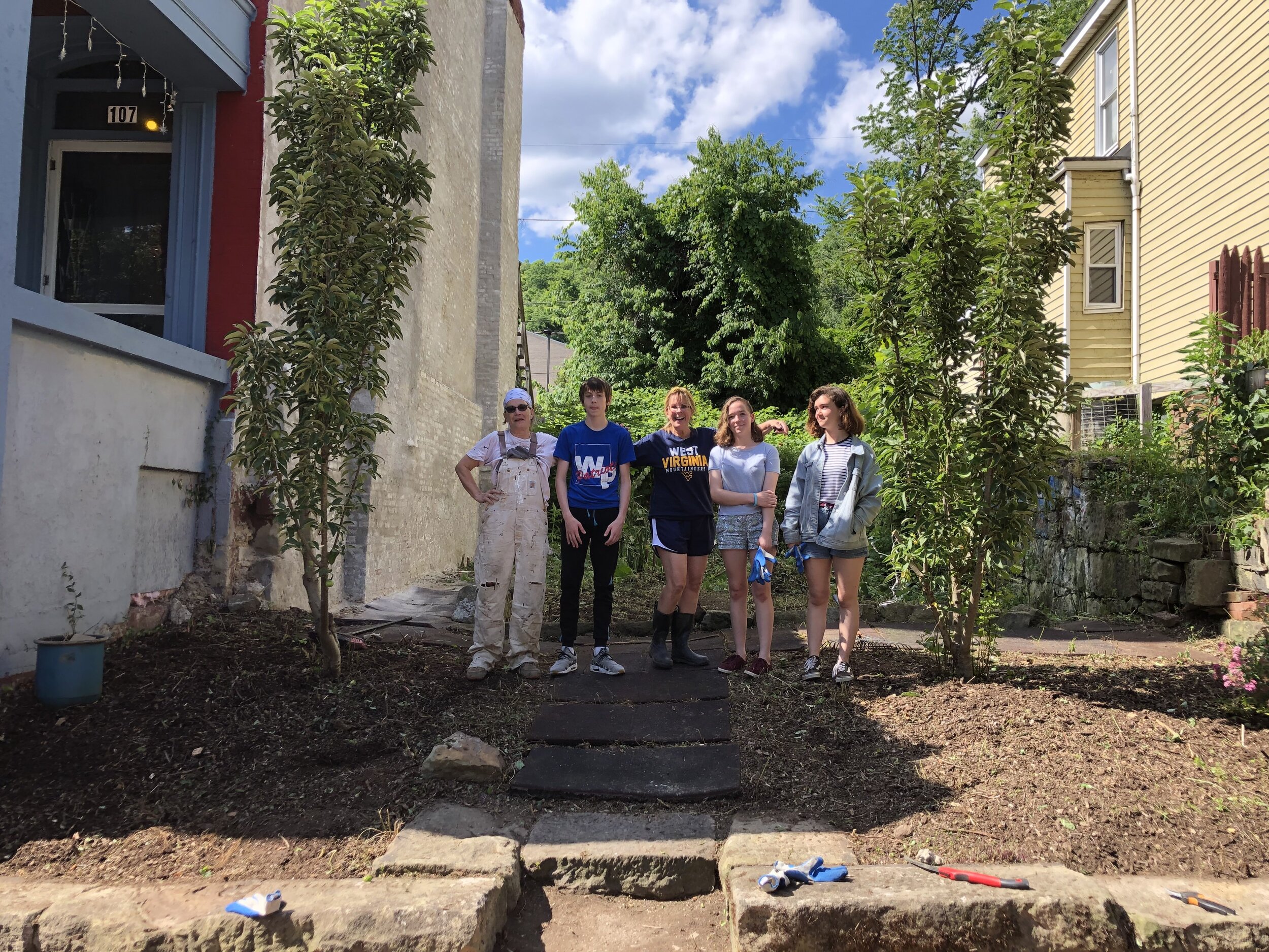 Beautiful neighborhoods matter to street moms. Some youth in the neighborhood volunteered to help.