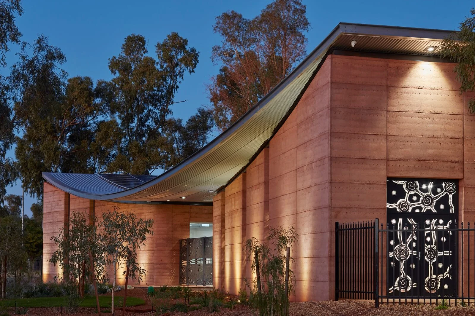 Rammed earth external at dusk
