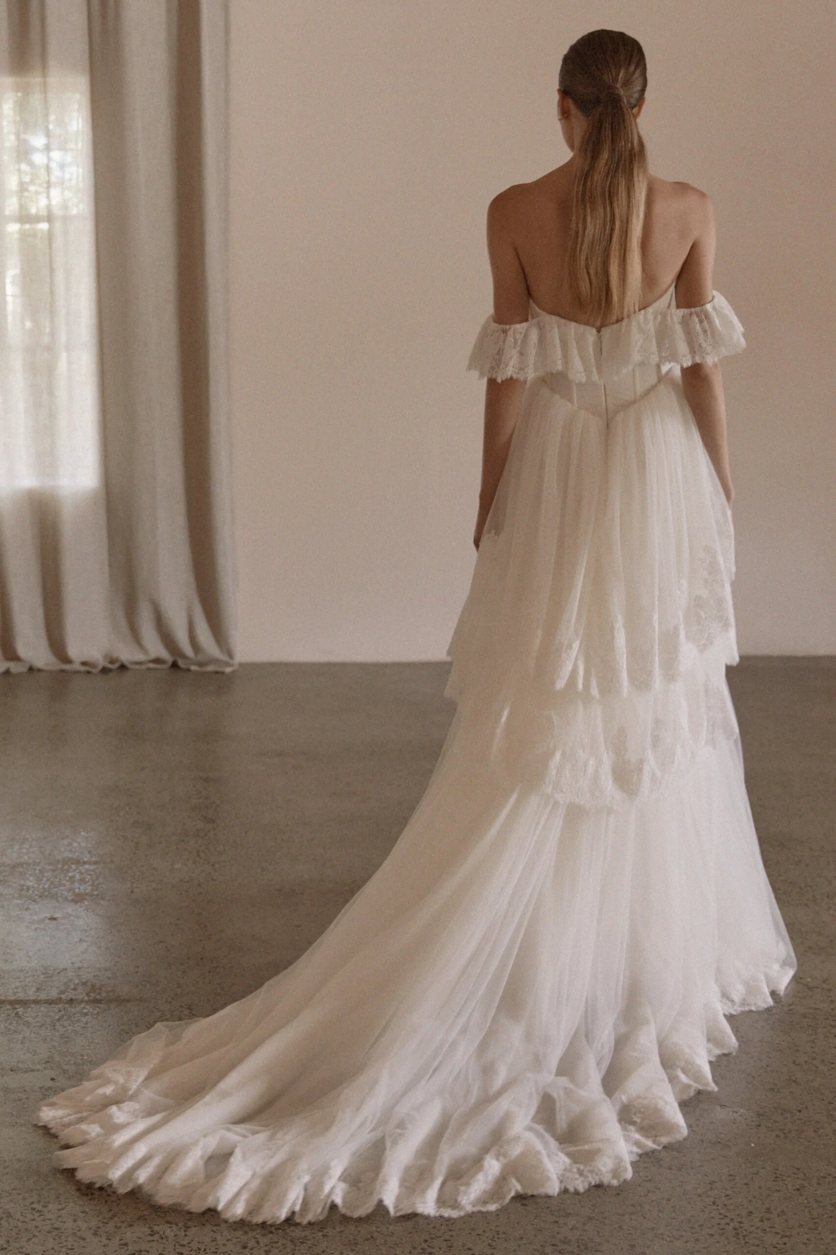Juliette by Vagabond Bridal, available exclusively at The Art of Bridal bridal boutique, Brisbane, Queensland. Juliette is a feminine ode to softness — a romantic Italian tulle gown that drapes with ethereal lightness and moves like a breath of air. 