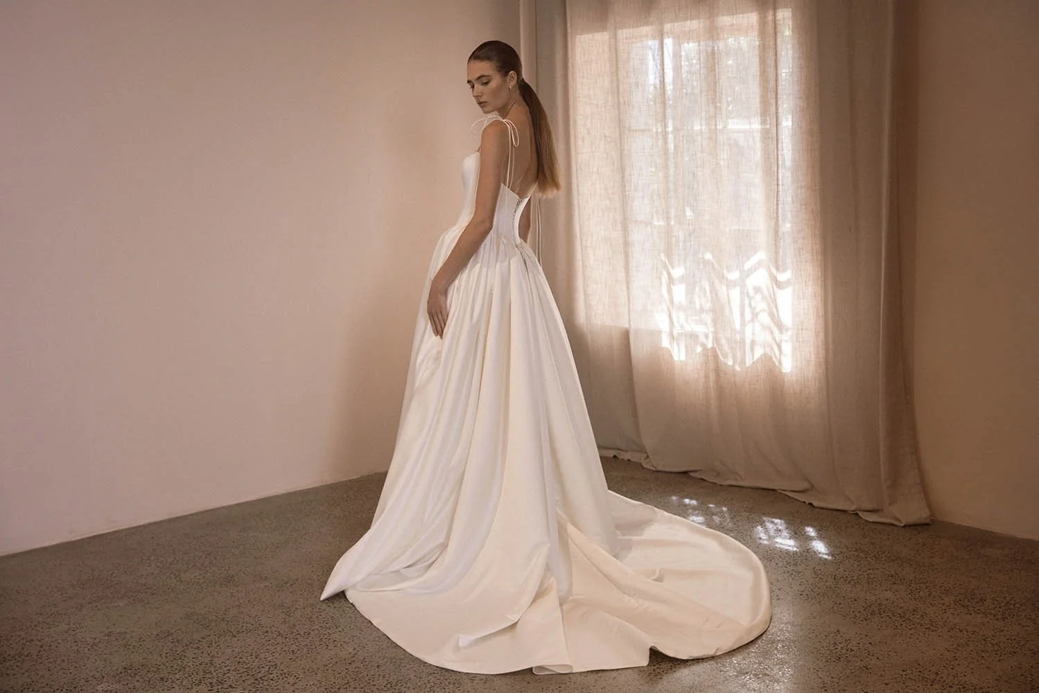 Alba by Vagabond Bridal featuring ivory satin ballgown silhouette and scoop neckline with Chantilly lace trim available exclusively at The Art of Bridal, Brisbane bridal boutique Queensland.