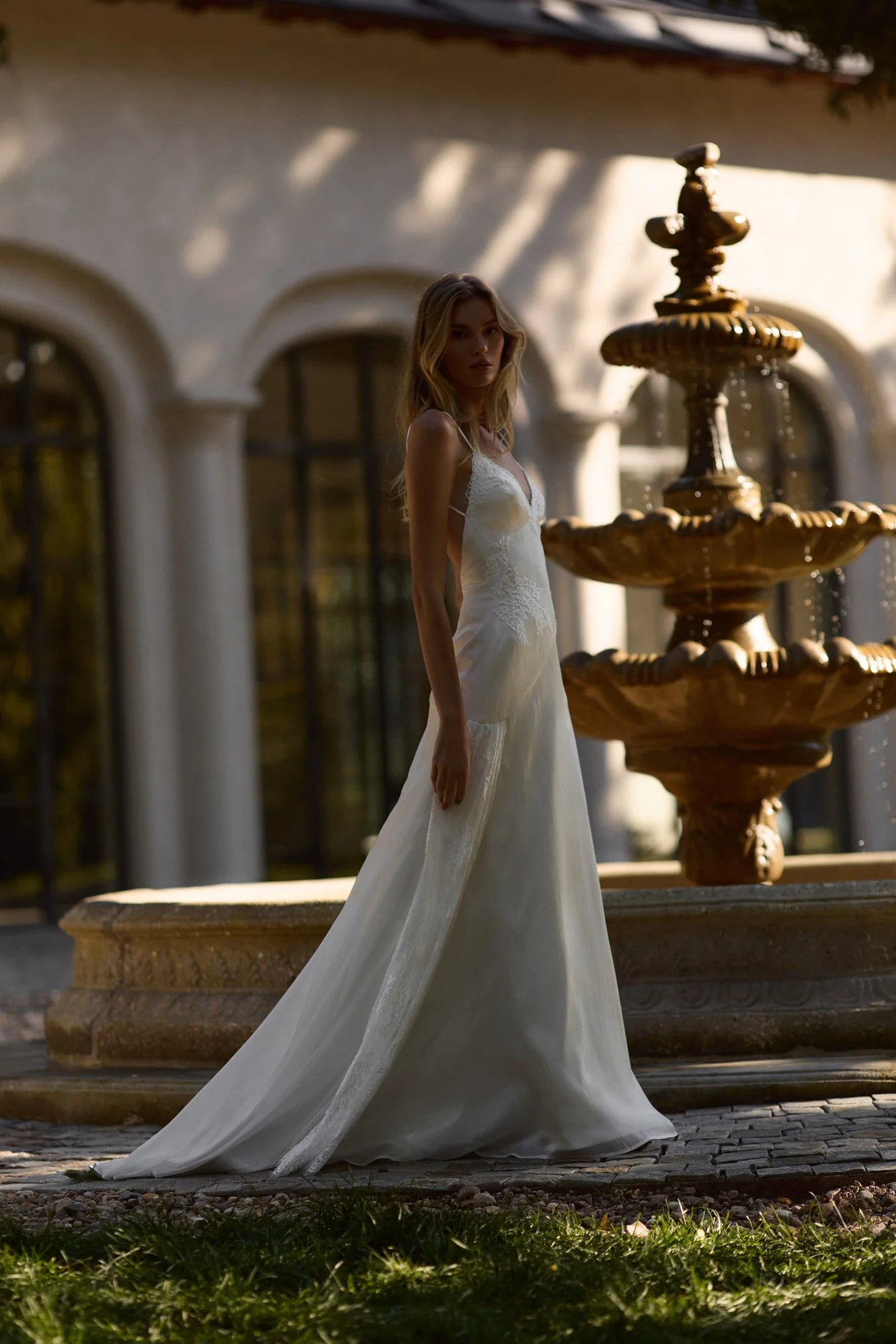 Martina by Romanova Atelier available at The Art of Bridal exclusively in Australia. Chiffon, v-neck style with romantically soft shape.
