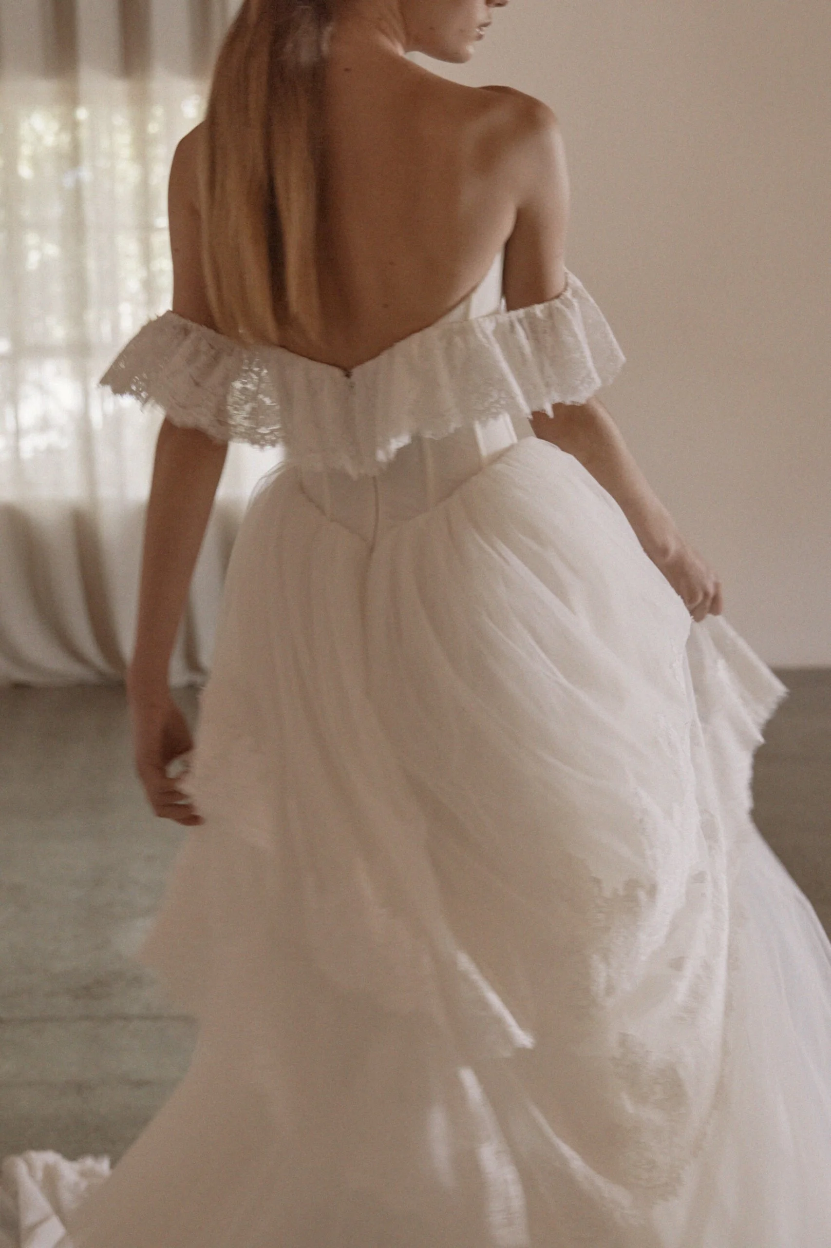 Juliette by Vagabond Bridal, available exclusively at The Art of Bridal bridal boutique, Brisbane, Queensland. Juliette is a feminine ode to softness — a romantic Italian tulle gown that drapes with ethereal lightness and moves like a breath of air. 