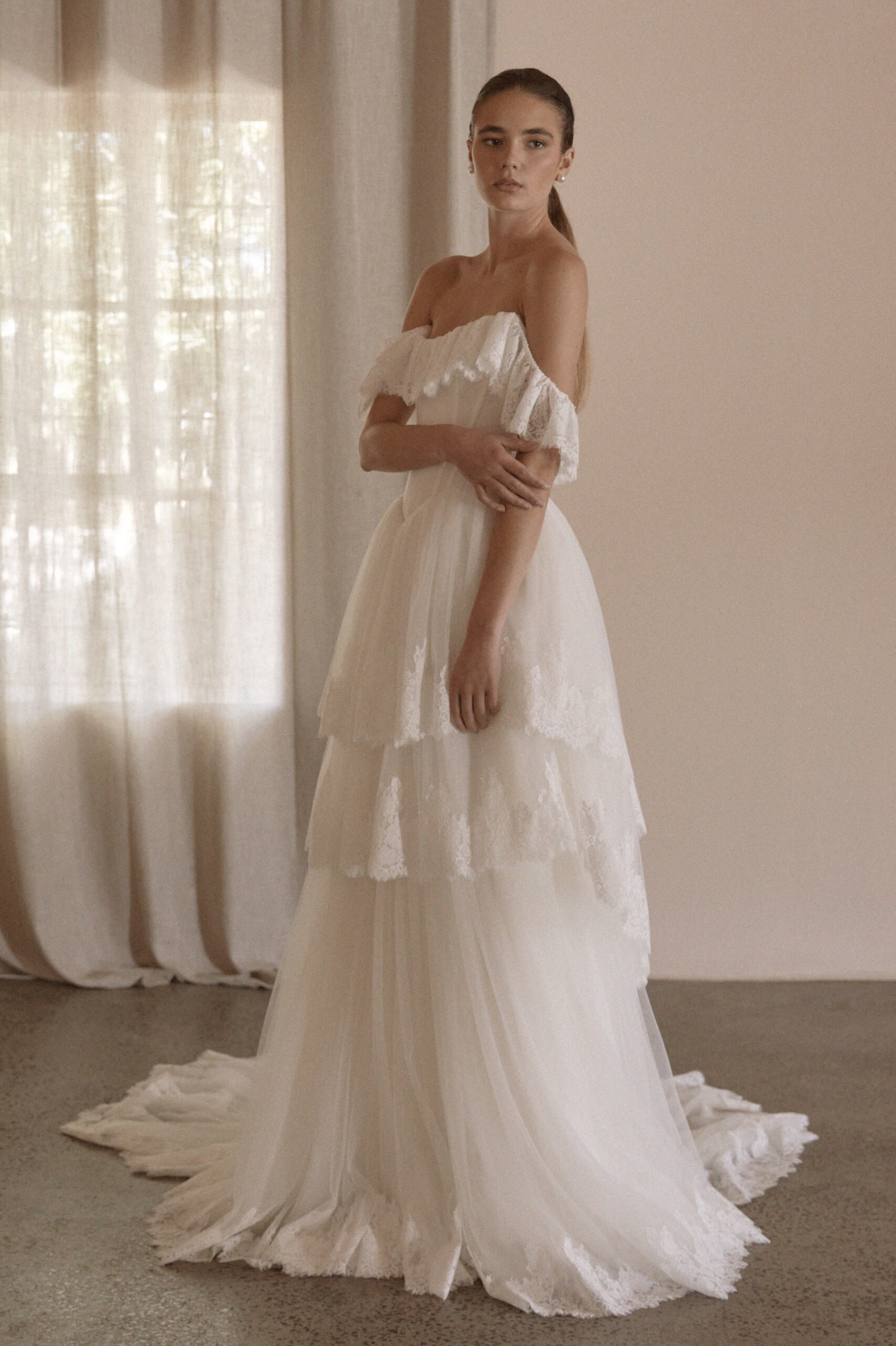 Juliette by Vagabond Bridal, available exclusively at The Art of Bridal bridal boutique, Brisbane, Queensland. Juliette is a feminine ode to softness — a romantic Italian tulle gown that drapes with ethereal lightness and moves like a breath of air. 