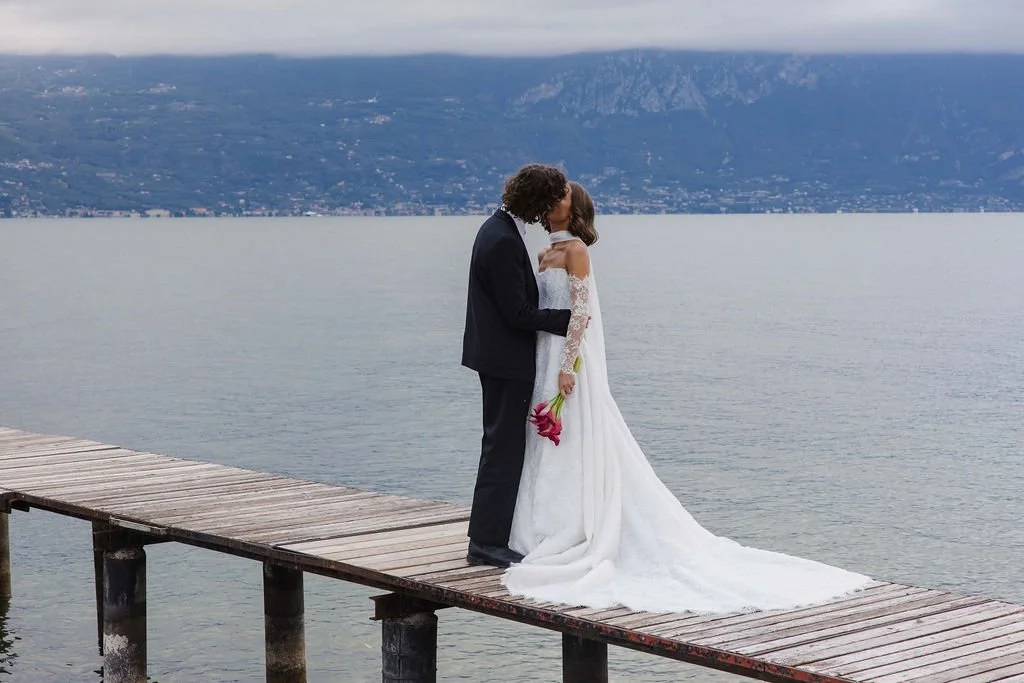 Emma wearing Dahlia in chantilly lace by Alena Leena for her Lake Como destination wedding.