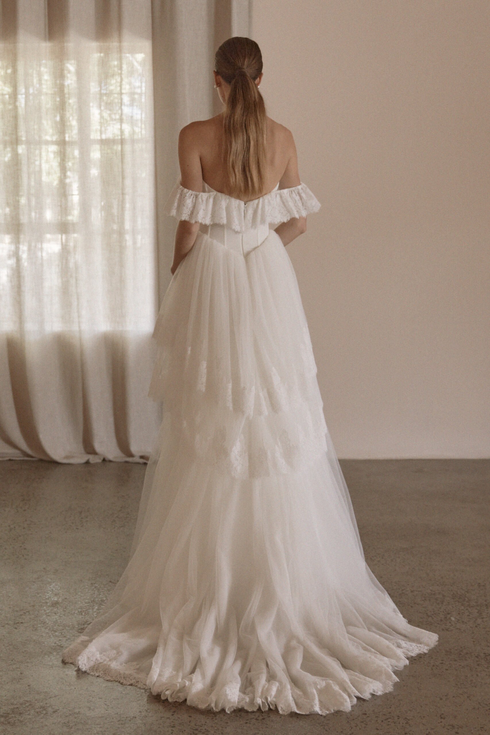 Juliette by Vagabond Bridal, available exclusively at The Art of Bridal bridal boutique, Brisbane, Queensland. Juliette is a feminine ode to softness — a romantic Italian tulle gown that drapes with ethereal lightness and moves like a breath of air. 