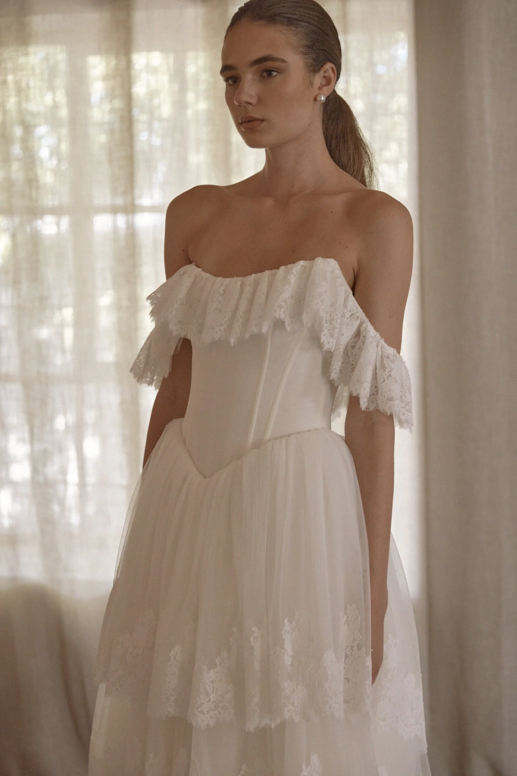 Juliette by Vagabond Bridal, available exclusively at The Art of Bridal bridal boutique, Brisbane, Queensland. Juliette is a feminine ode to softness — a romantic Italian tulle gown that drapes with ethereal lightness and moves like a breath of air. 