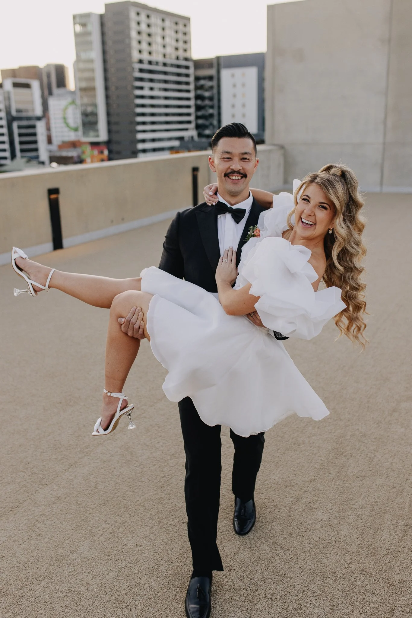 Demi wearing her bespoke Art of Bridal piece for her wedding at premier Brisbane venue The Calile Hotel.