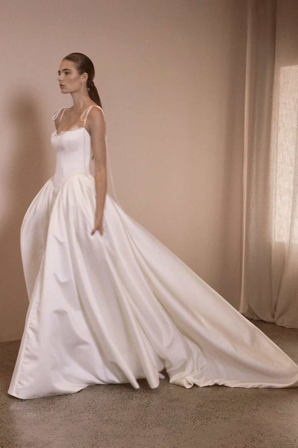Alba by Vagabond Bridal featuring ivory satin ballgown silhouette and scoop neckline with Chantilly lace trim available exclusively at The Art of Bridal, Brisbane bridal boutique Queensland.