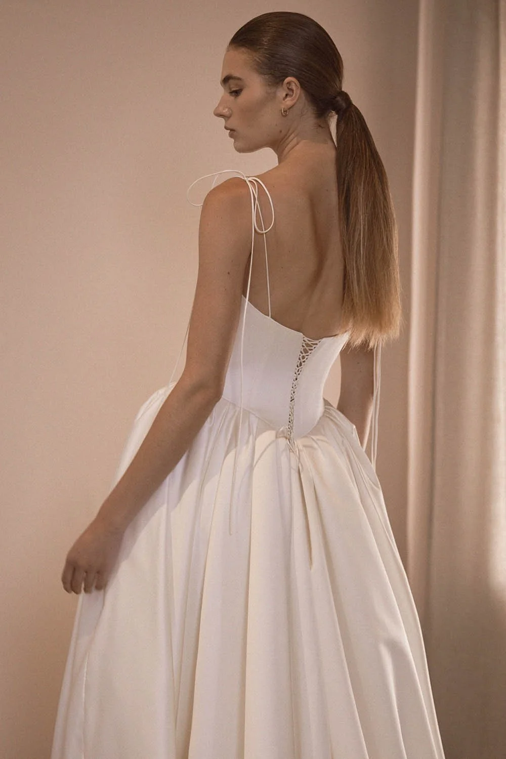 Alba by Vagabond Bridal featuring ivory satin ballgown silhouette and scoop neckline with Chantilly lace trim available exclusively at The Art of Bridal, Brisbane bridal boutique Queensland.