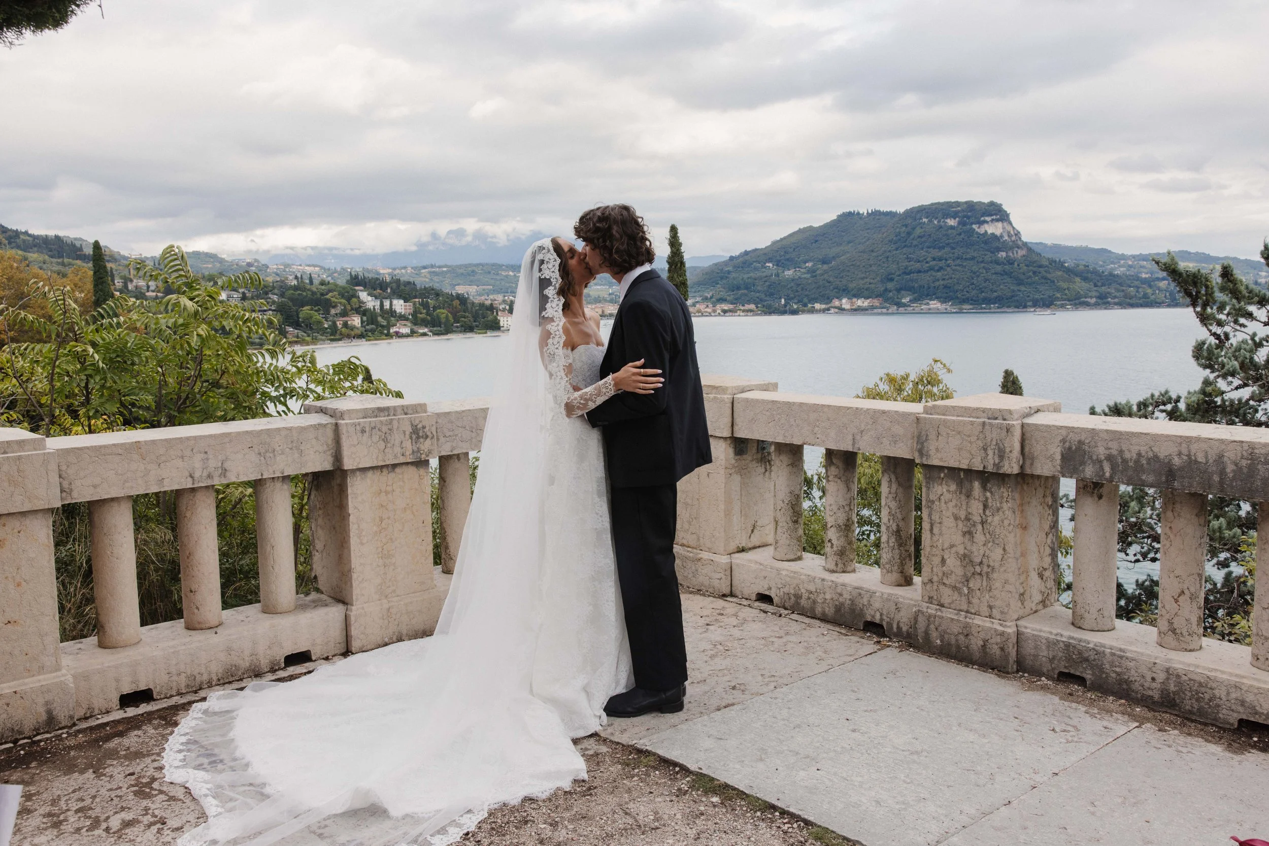 Emma in Alena leena captured by Brie Conomos at Lake Como. A beautiful afternoon in chantilly lace from The Art of Bridal (Previously The Veil Collective).