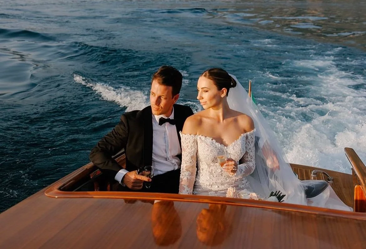 A beautiful real bride wearing Azalea by Alena Leena, a full lace, off the shoulder, fitted wedding dress. Married at Lake Como in Italy.