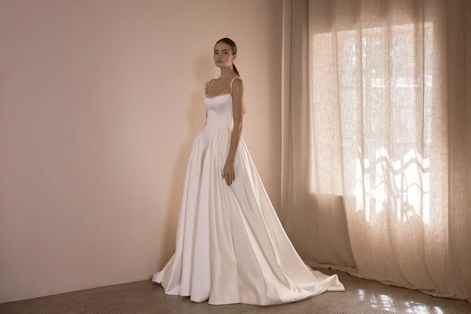 Alba by Vagabond Bridal featuring ivory satin ballgown silhouette and scoop neckline with Chantilly lace trim available exclusively at The Art of Bridal, Brisbane bridal boutique Queensland.