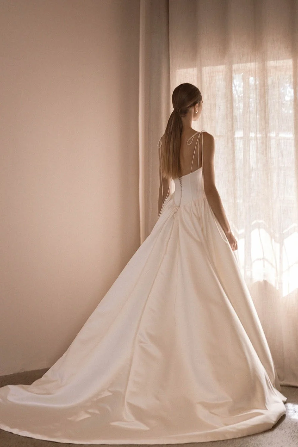 Alba by Vagabond Bridal featuring ivory satin ballgown silhouette and scoop neckline with Chantilly lace trim available exclusively at The Art of Bridal, Brisbane bridal boutique Queensland.
