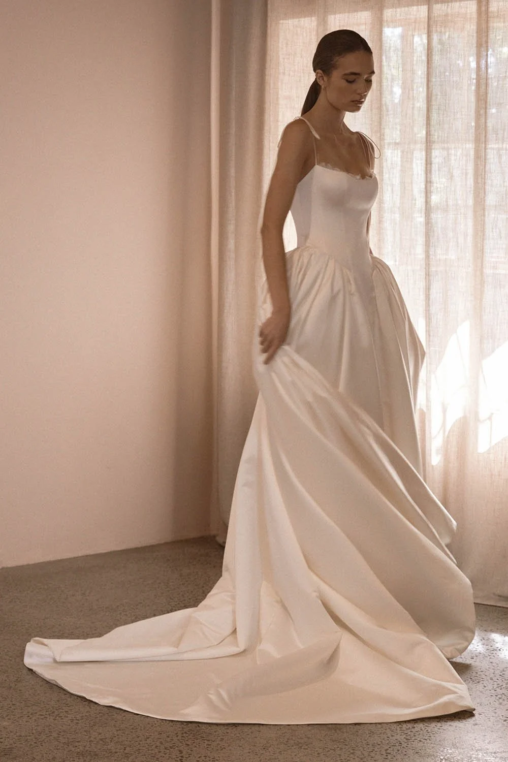 Alba by Vagabond Bridal featuring ivory satin ballgown silhouette and scoop neckline with Chantilly lace trim available exclusively at The Art of Bridal, Brisbane bridal boutique Queensland.