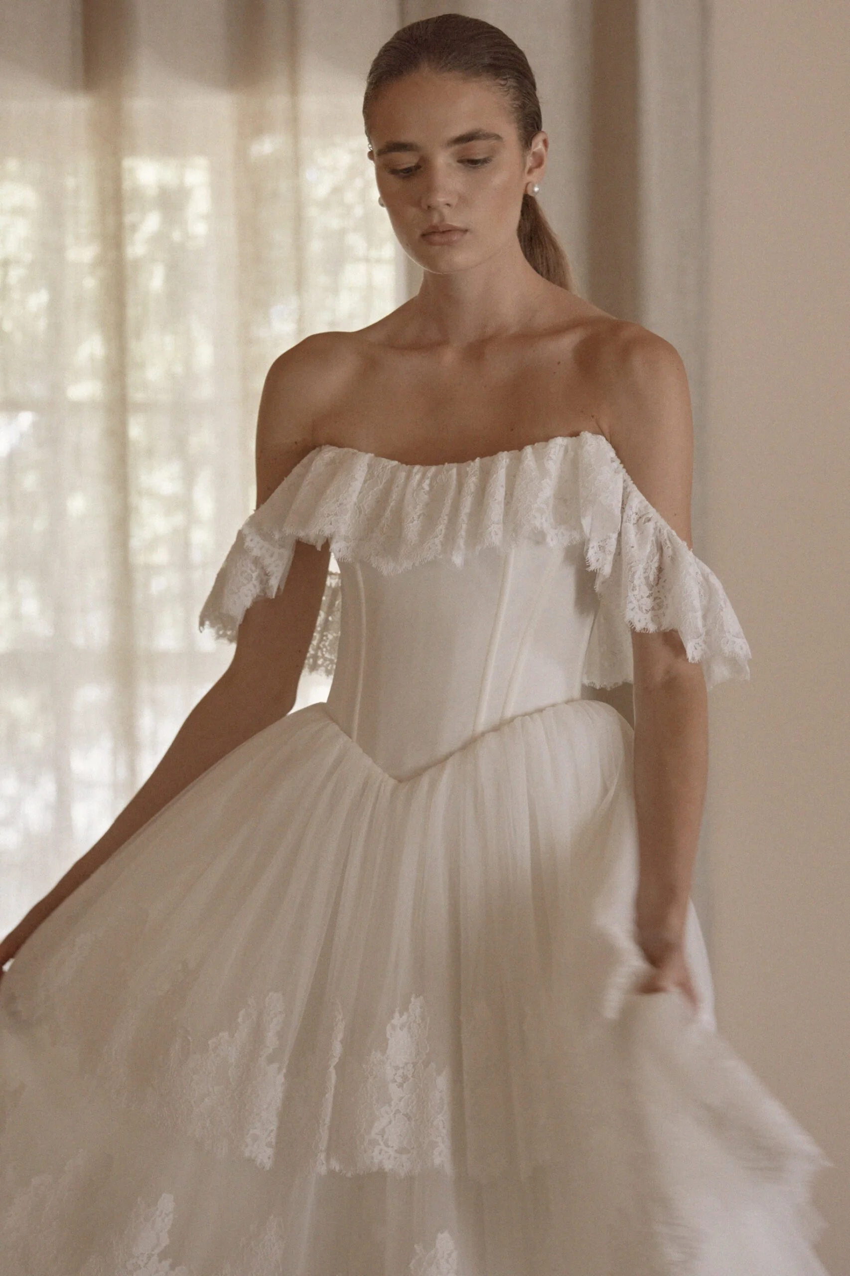 Juliette by Vagabond Bridal, available exclusively at The Art of Bridal bridal boutique, Brisbane, Queensland. Juliette is a feminine ode to softness — a romantic Italian tulle gown that drapes with ethereal lightness and moves like a breath of air. 