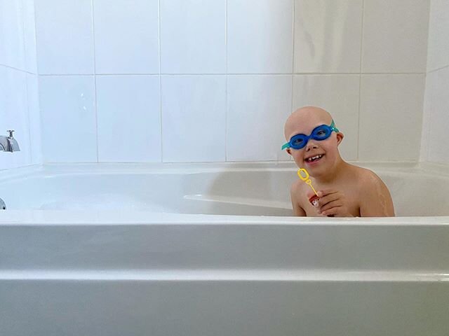 Swimming is his favourite. Pools are closed, he doesn&rsquo;t understand why - so now we pretend swim in the bathtub. With bubbles. #stayhomestaysafe