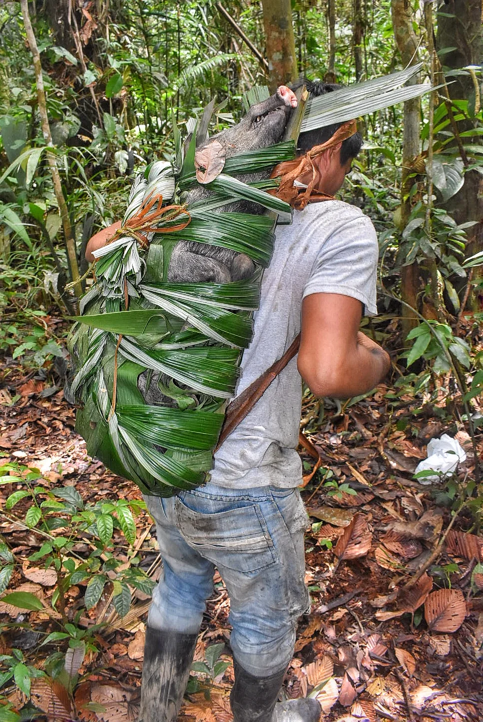 Fransisco, with the boar in his hand crafted backpack. Image by Scott Haber