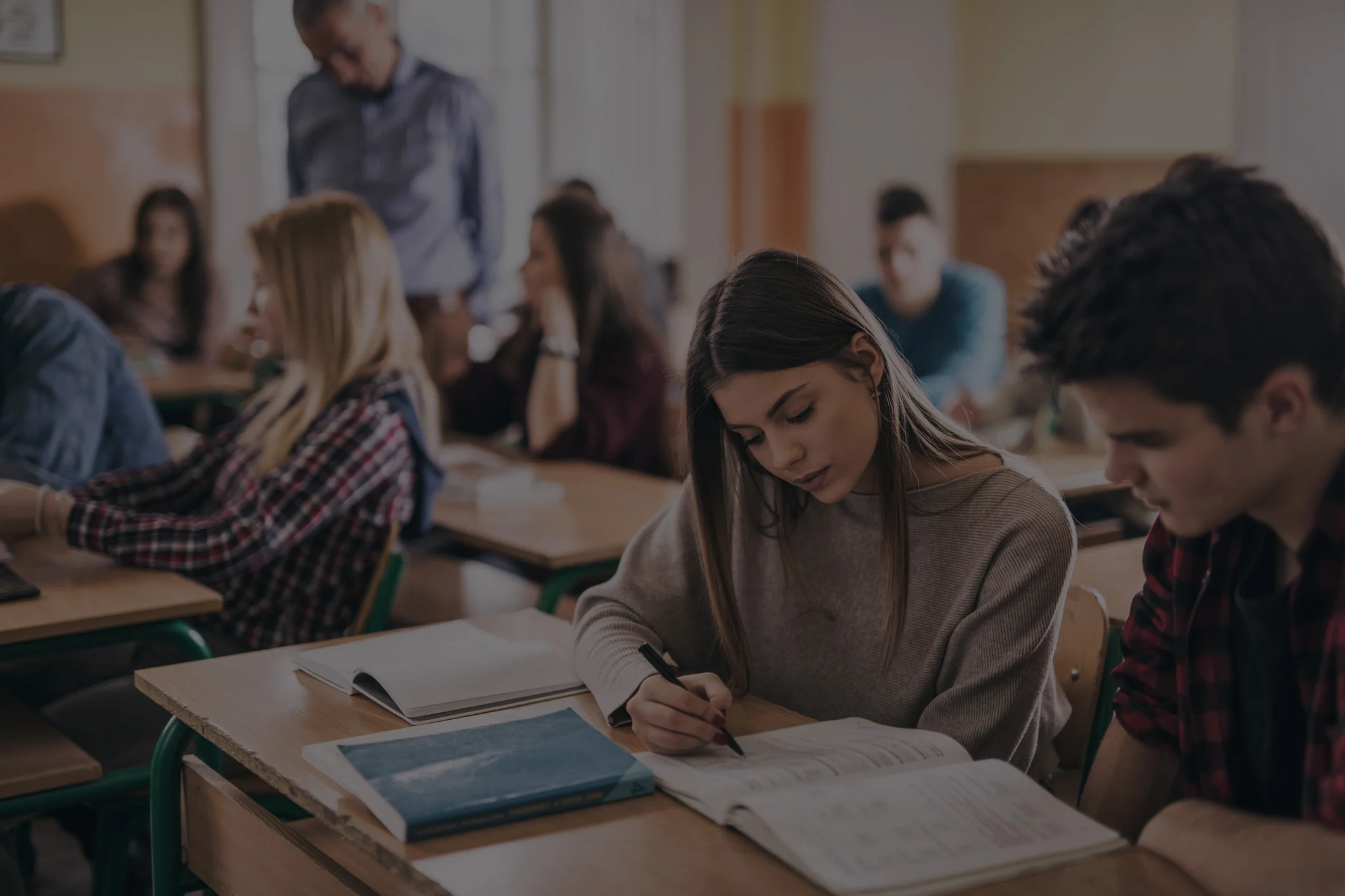 Female-student-and-her-classmate-learning-together-in-the-classroom.jpg