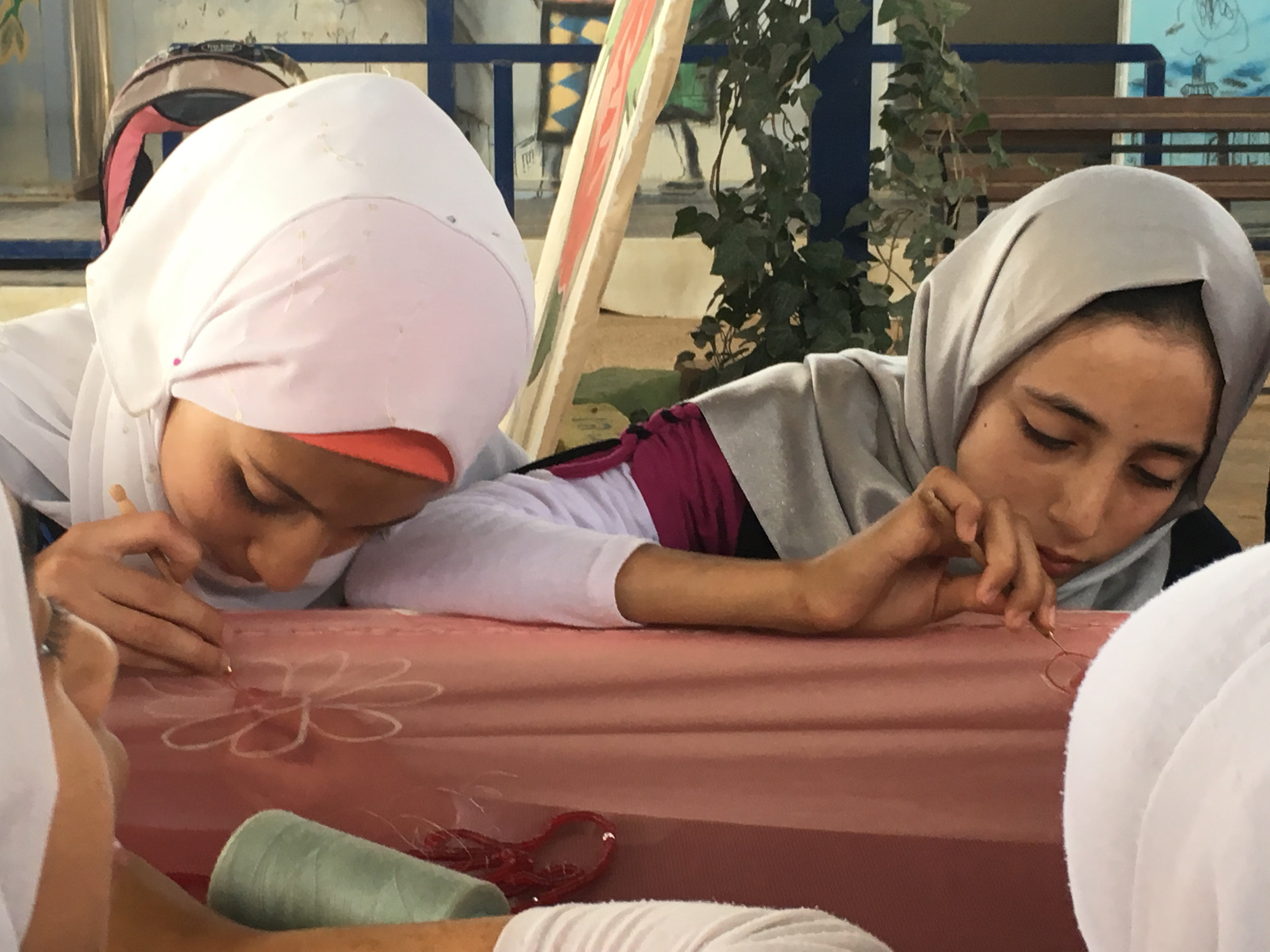 Tiger Girls concentrating on their new embroidery skills
