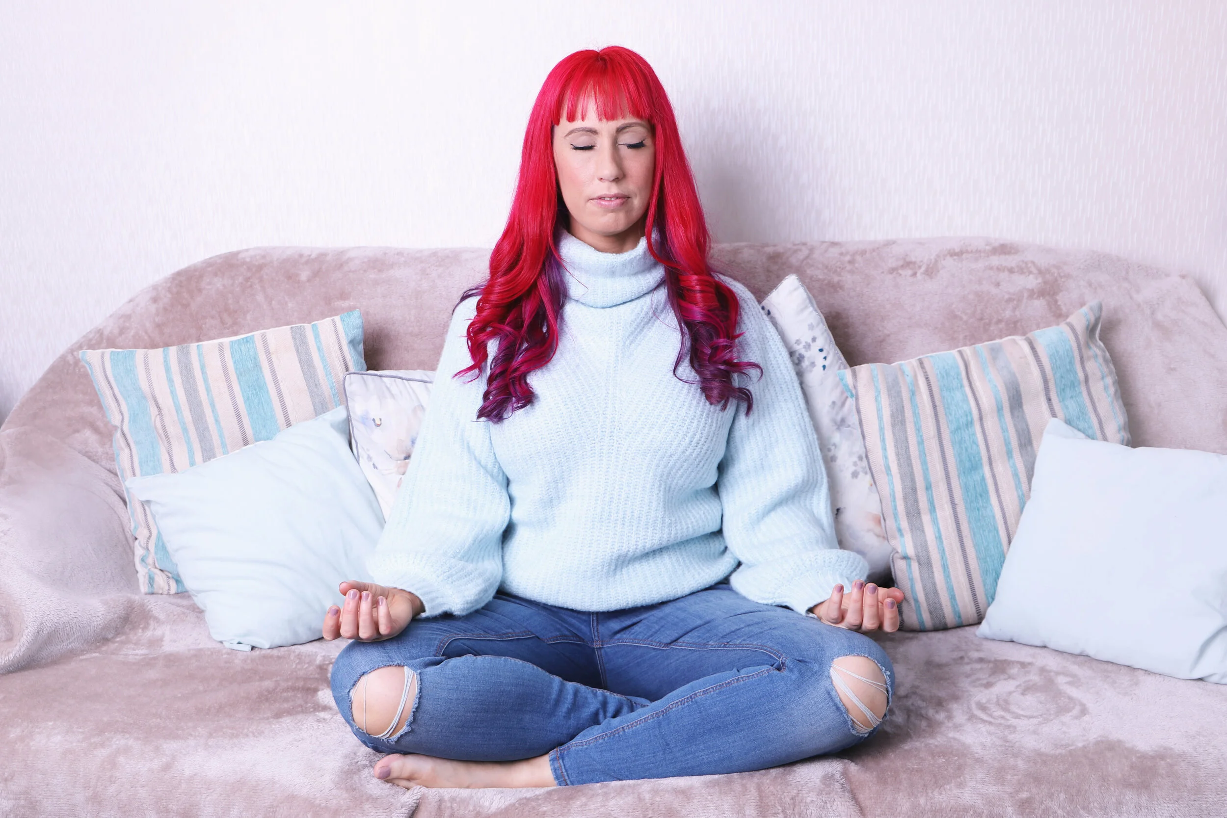 Meditating on the couch palms.jpg