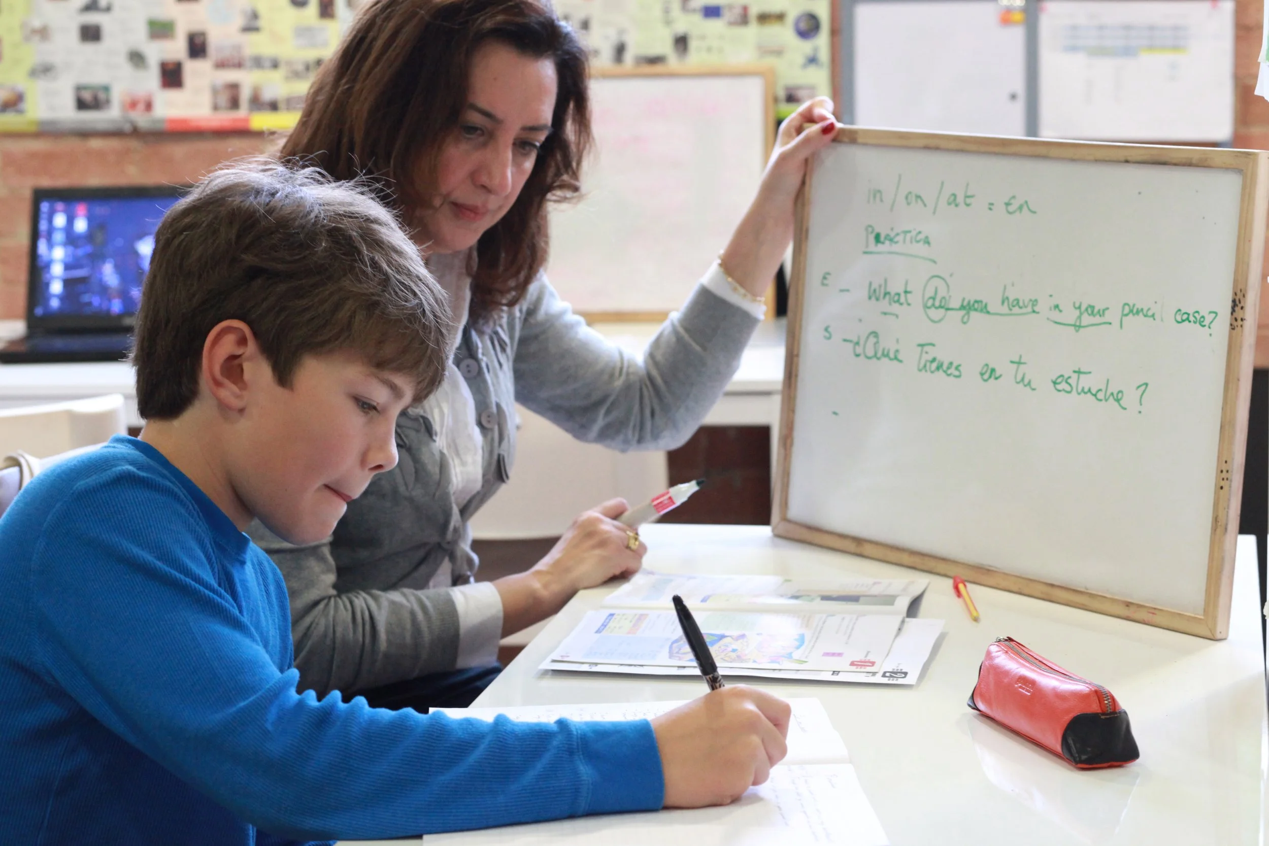 Tutor and pupil studying 1 on 1