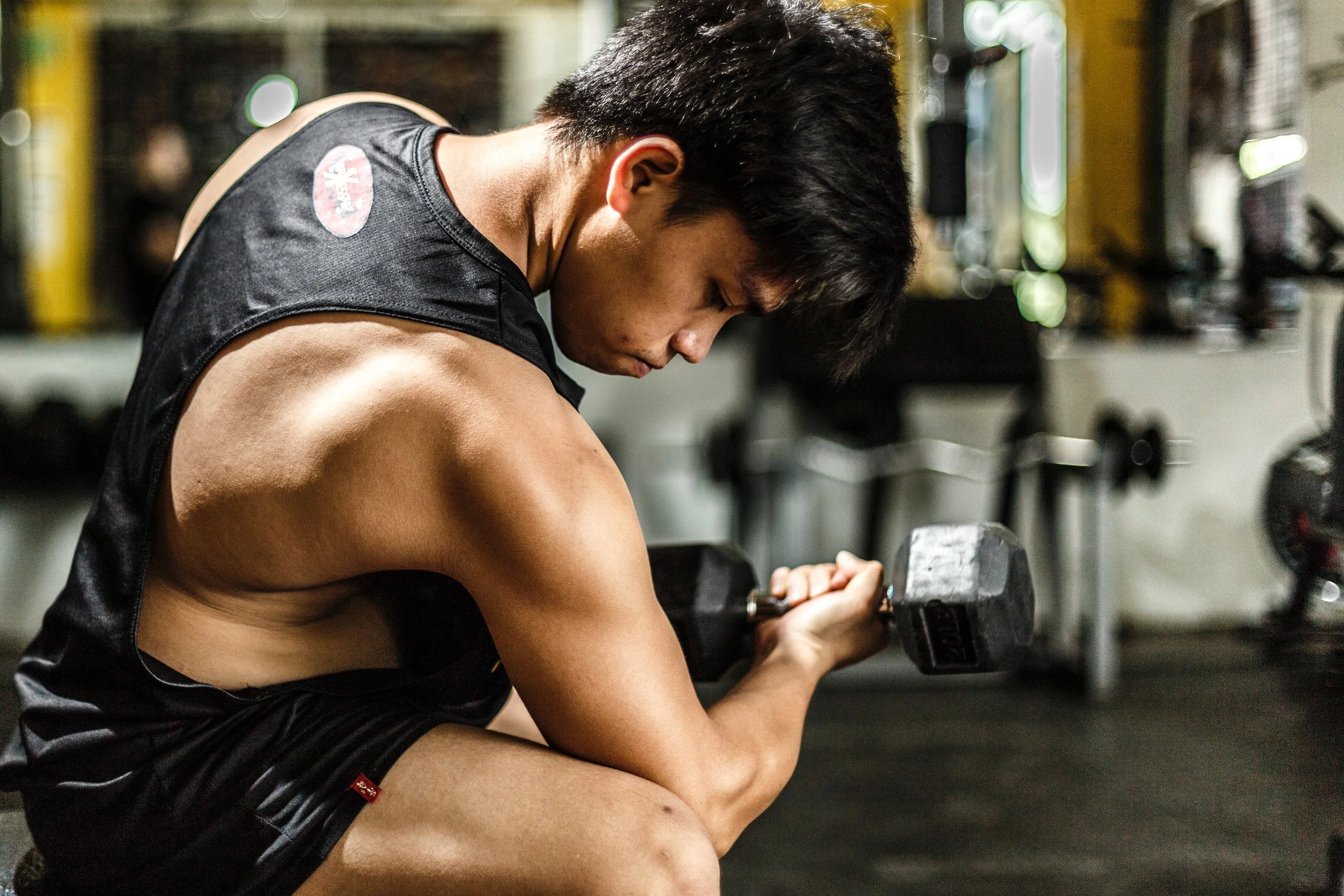 athlete-barbell-blurred-background-700446.jpg