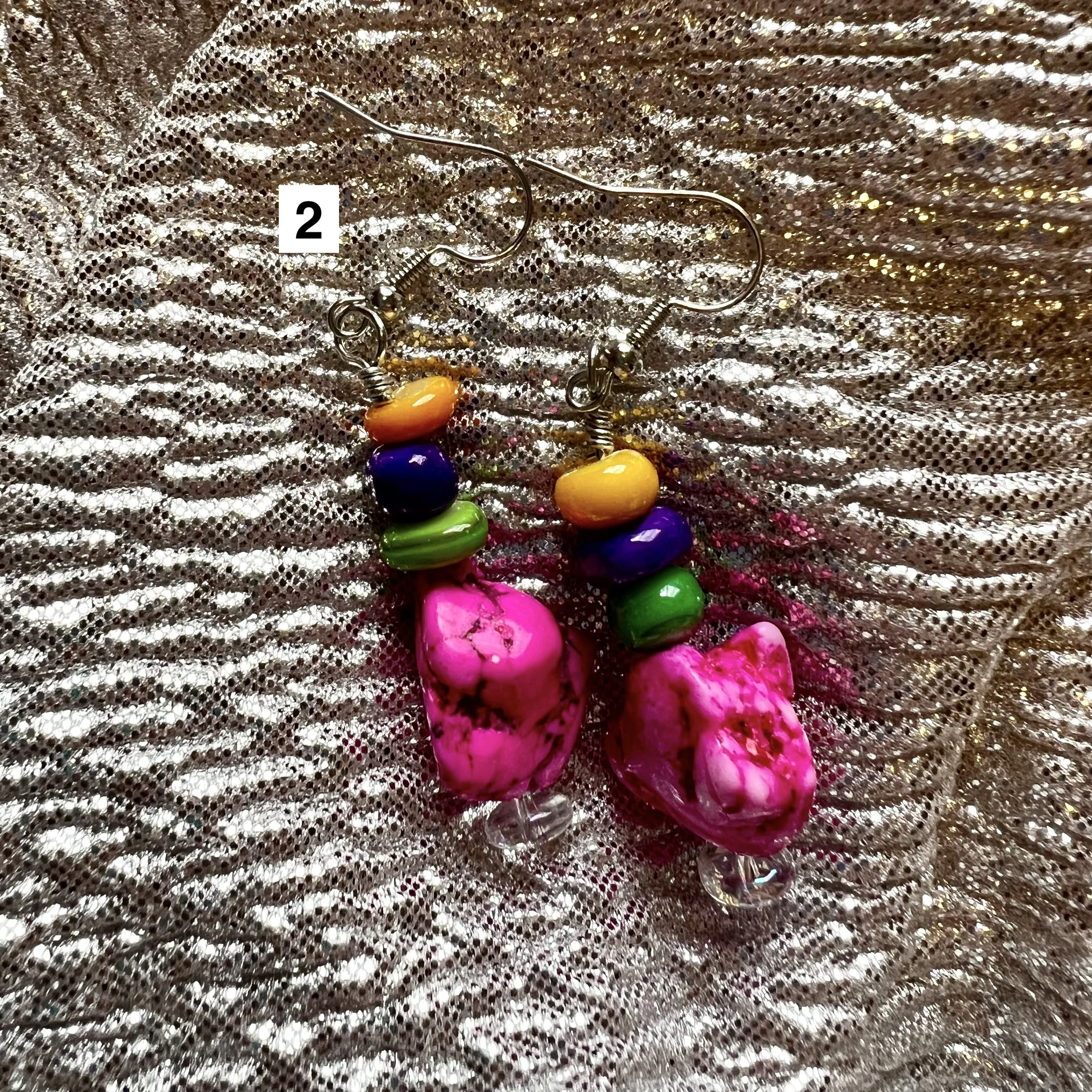 pair of handmade beaded earrings with stone beads, featuring colors pink, purple, yellow, and green
