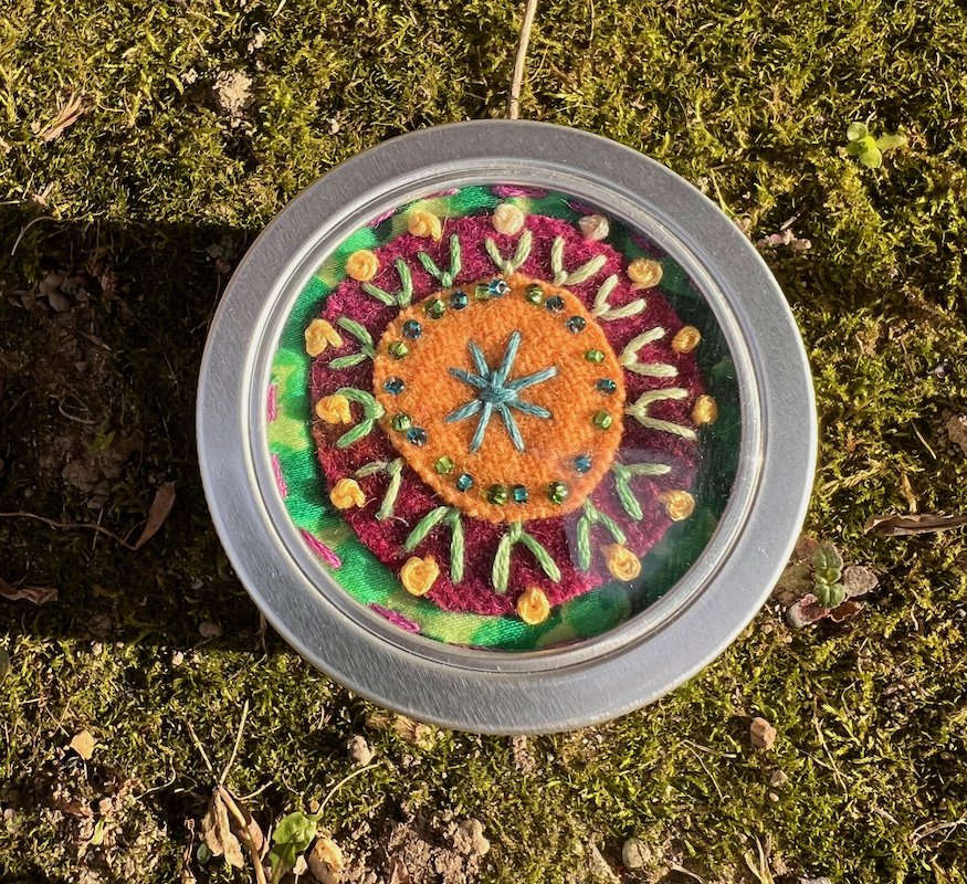 multimedia stash jar orange with blue star center 2.jpg
