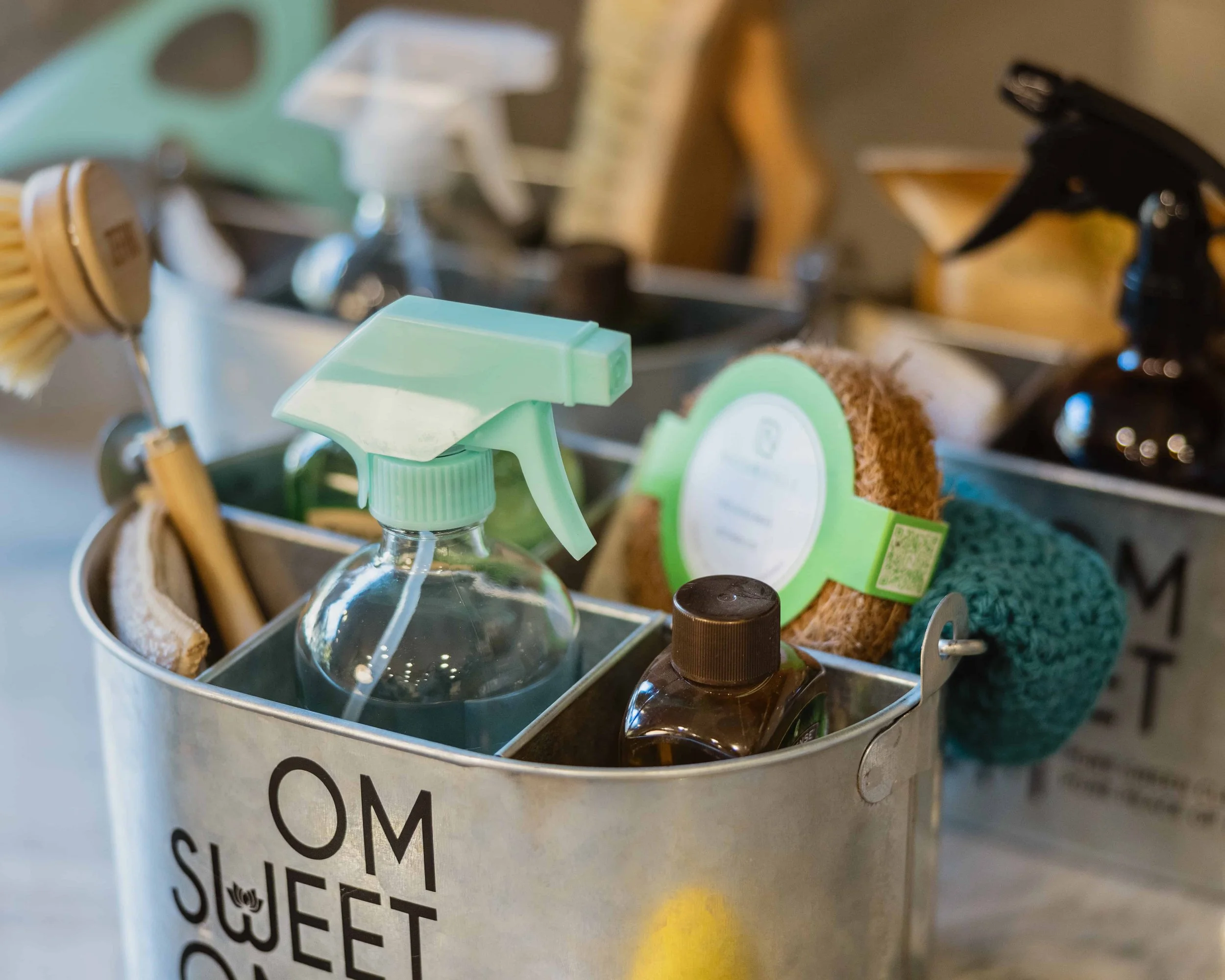 bucket filled with om sweet om holistic home cleaning supplies