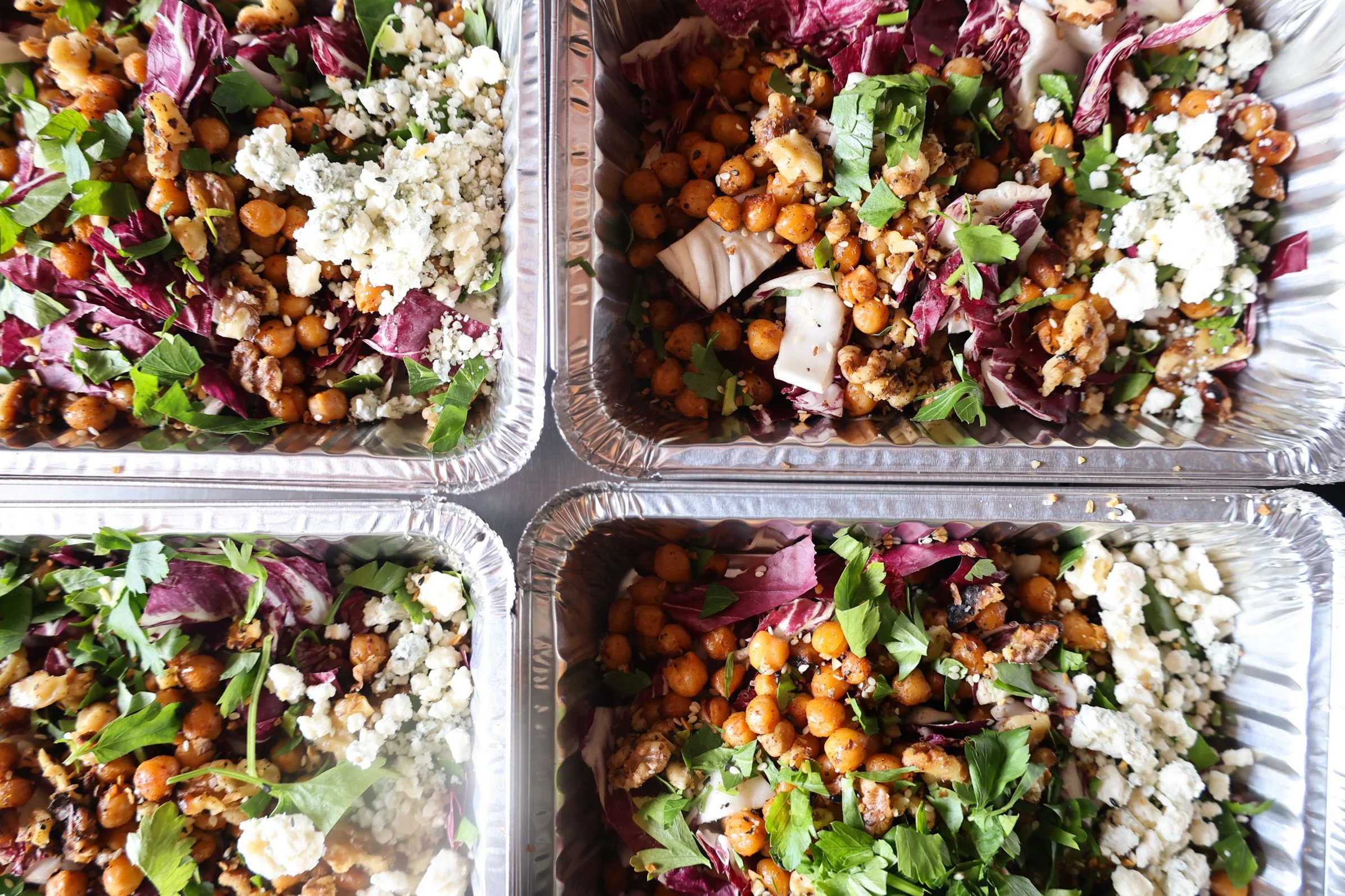 Photo of toasty chickpea bowl with greens, radicchio and fresh herbs