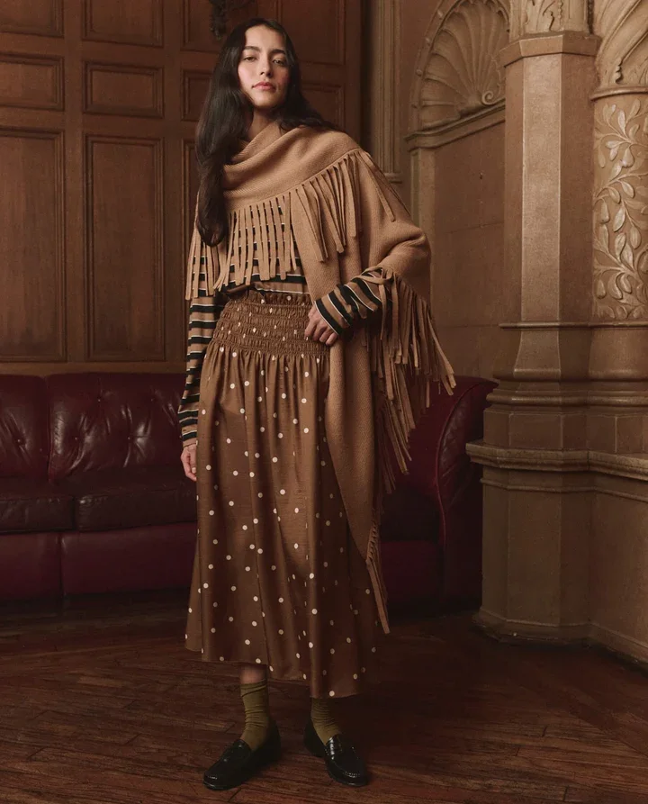 THE-GREAT-LOOK-23-THE-LONG-SLEEVE-RELAXED-CREW-CIGAR-STRIPE-THE-CANARY-SKIRT-COPPER-BUBBLE-DOT-THE-BIG-SWEATER-FRINGE-SCARF-CAMEL-02913_720x.webp