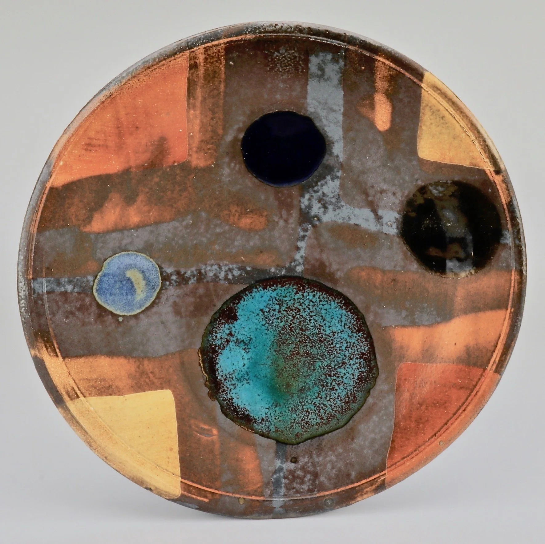 Baskin-5 Plate, 9_, black clay,  soda fire, 2023.jpg