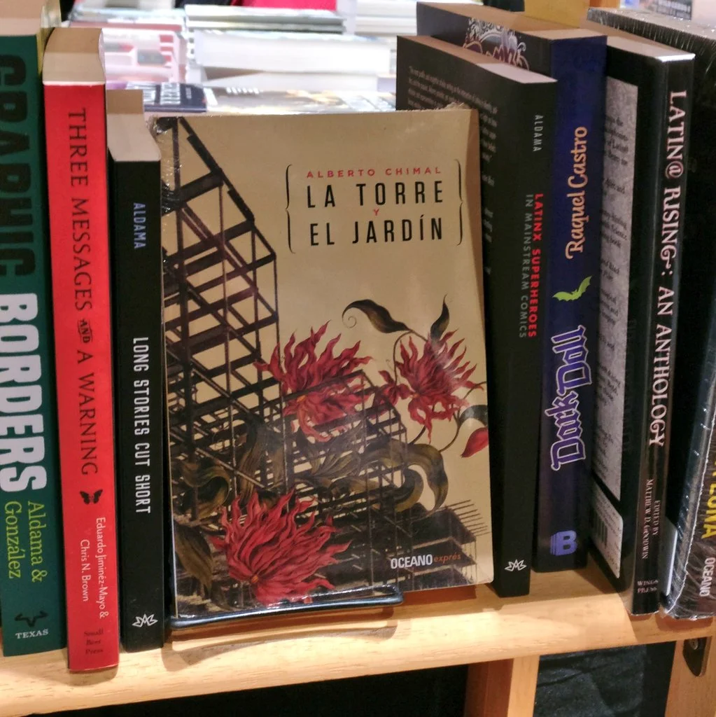 A shelf full of Latinx books for sale at Worldcon 76
