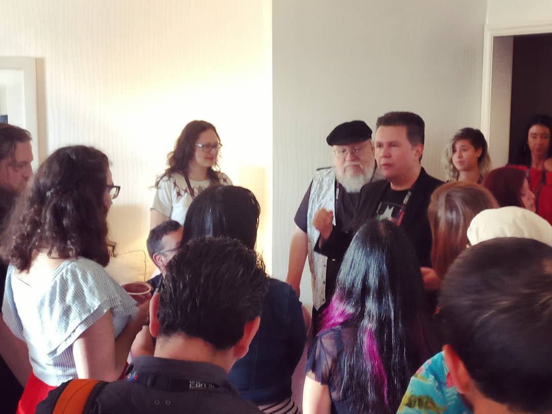 Mexicanx Initiative participants and George R. R. Martin listen to John Picacio speaking at the Mexicanx Initiative Reception (Photo by Alberto Chimal)